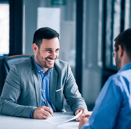 Two men talking in a business meeting.
